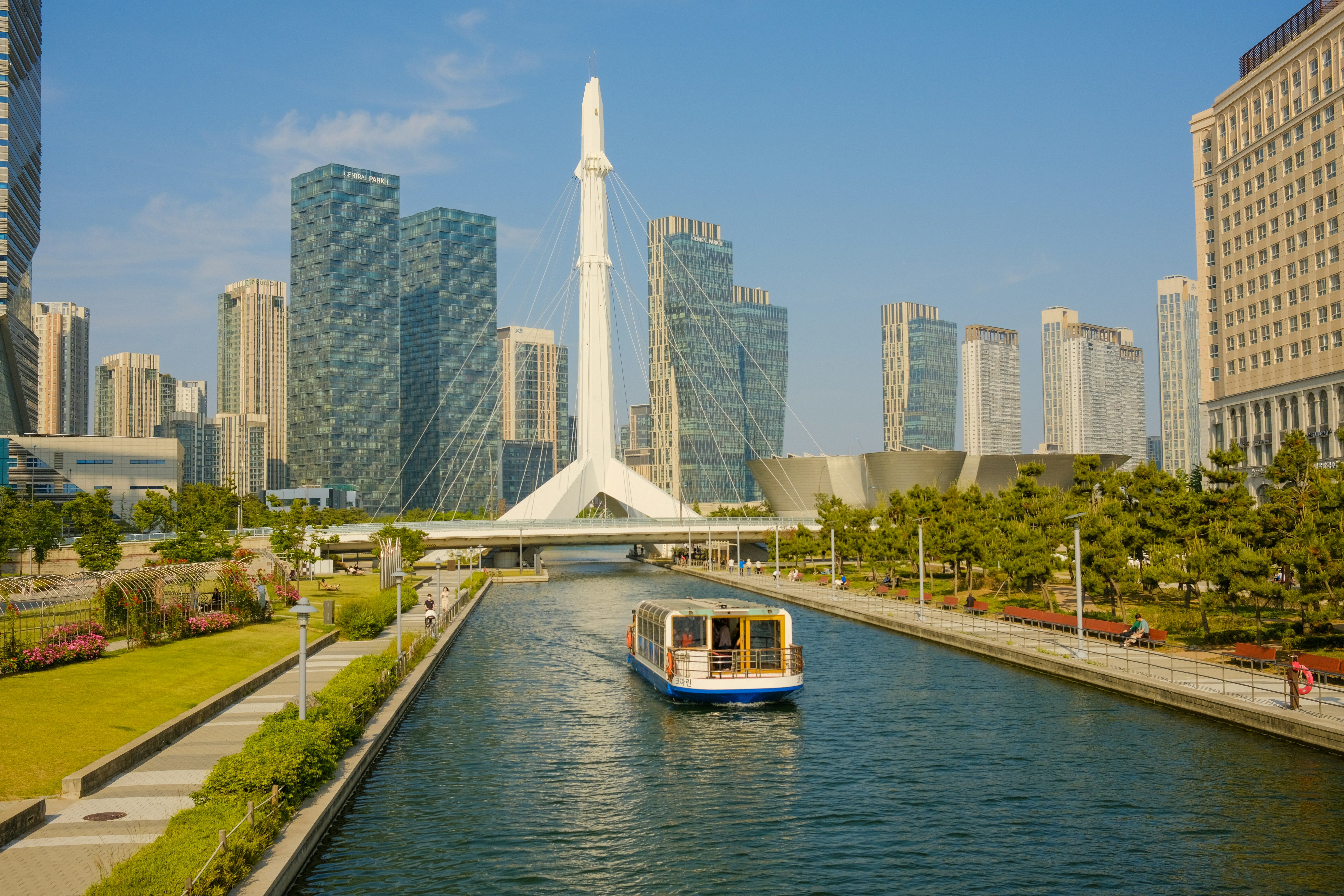 An image of a park in Songdo, Incheon in South Korea with tall office buildings in the background